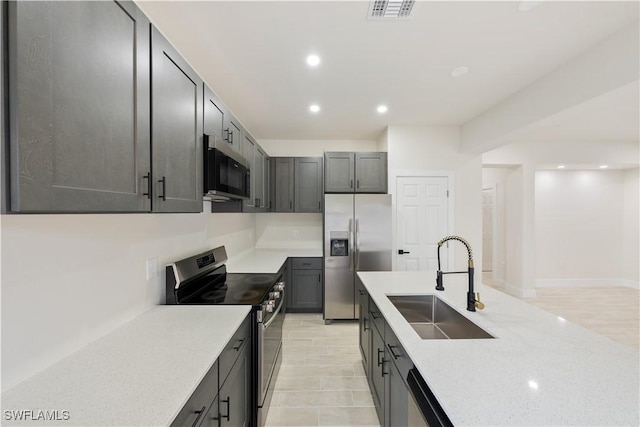 2703 54th St W, Lehigh Acres, FL 33971 - kitchen featuring stainless steel appliances, recessed lighting, and light stone counters