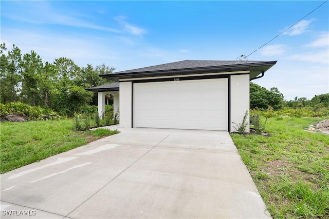 2703 54th St W, Lehigh Acres, FL 33971 - garage featuring concrete driveway