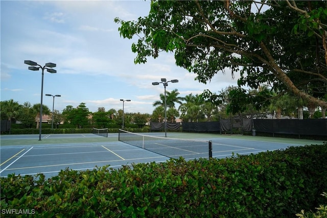2445 Orchard St, Naples, FL 34120 - view of tennis court featuring community basketball court