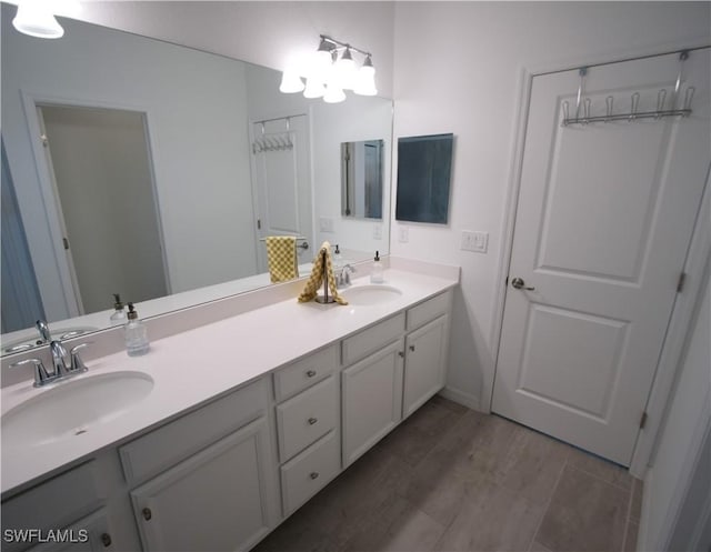 2445 Orchard St, Naples, FL 34120 - bathroom with double vanity and baseboards