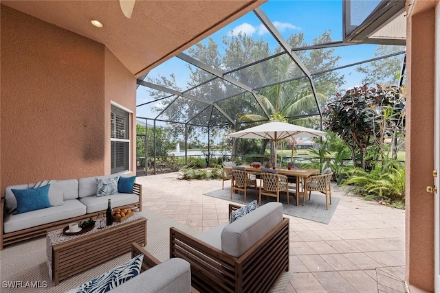 19793 Casa Verde Way, Estero, FL 33967 - view of patio / terrace with outdoor lounge area, outdoor dining area, and glass enclosure