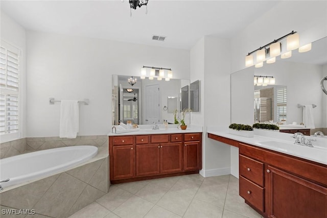 19793 Casa Verde Way, Estero, FL 33967 - bathroom featuring tile patterned flooring, two vanities, and a bath