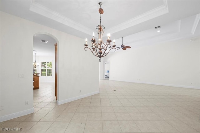 19793 Casa Verde Way, Estero, FL 33967 - empty room featuring a raised ceiling, arched walkways, crown molding, a chandelier, and light tile patterned floors
