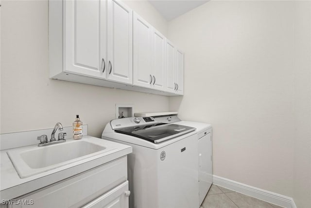 19793 Casa Verde Way, Estero, FL 33967 - laundry room featuring washer and dryer, cabinet space, and light tile patterned flooring