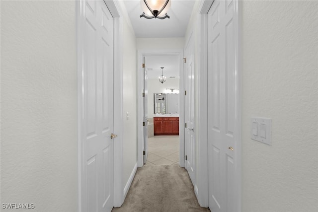 19793 Casa Verde Way, Estero, FL 33967 - hall with a textured wall, light carpet, and light tile patterned floors