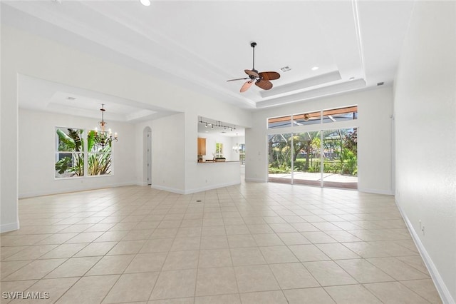 19793 Casa Verde Way, Estero, FL 33967 - spare room with a tray ceiling, ceiling fan, light tile patterned floors, recessed lighting, and a chandelier