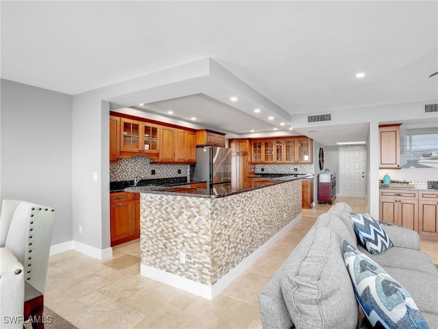 1100 N Collier Blvd Unit 920, Marco Island, FL 34145 - kitchen featuring freestanding refrigerator, recessed lighting, decorative backsplash, a spacious island, and wine cooler