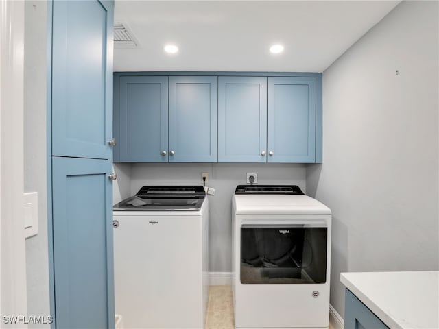 1100 N Collier Blvd Unit 920, Marco Island, FL 34145 - washroom featuring cabinet space, washer and dryer, and recessed lighting