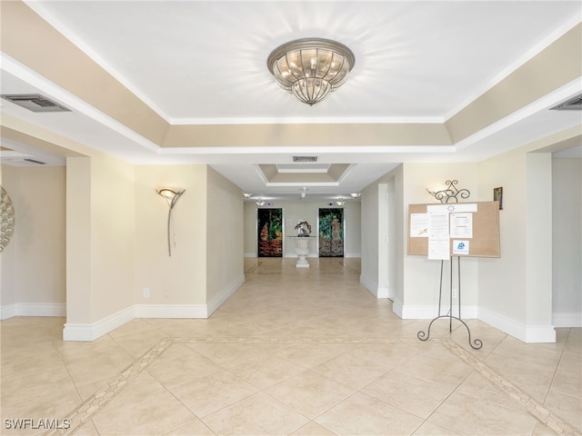 1100 N Collier Blvd Unit 920, Marco Island, FL 34145 - corridor with a tray ceiling, light tile patterned floors, and a chandelier
