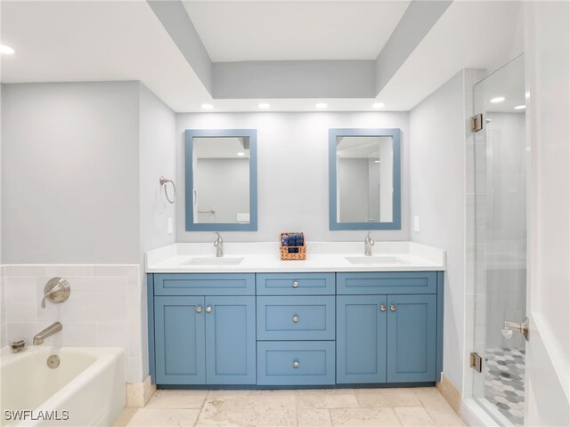 1100 N Collier Blvd Unit 920, Marco Island, FL 34145 - bathroom with recessed lighting, double vanity, a stall shower, and a bath