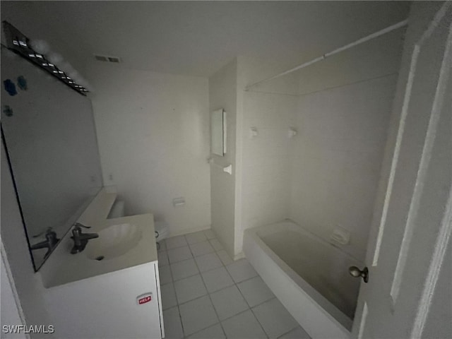 13020 Hamilton Harbour Dr Unit I3, Naples, FL 34110 - full bath featuring vanity, tile patterned flooring, and tub / shower combination