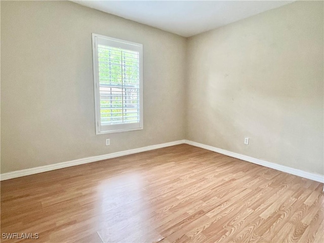 6300 S Pointe Blvd Unit 312, Fort Myers, FL 33919 - spare room featuring wood finished floors and baseboards