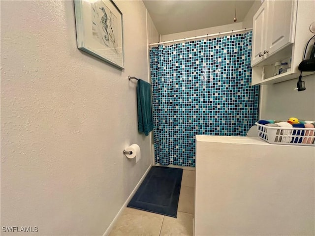 6300 S Pointe Blvd Unit 312, Fort Myers, FL 33919 - full bath with tile patterned floors and a tile shower