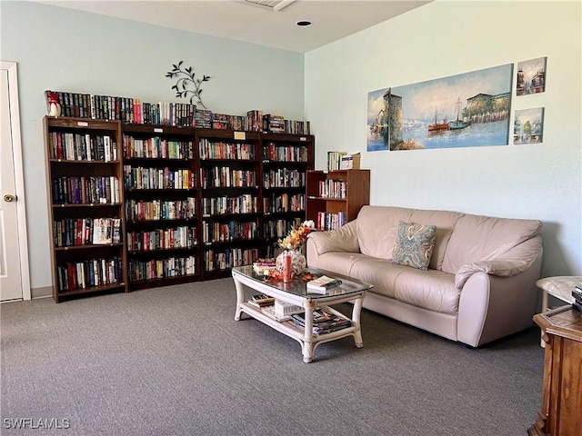 6300 S Pointe Blvd Unit 312, Fort Myers, FL 33919 - sitting room with bookshelves and carpet floors