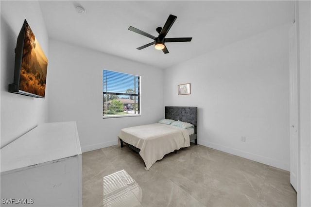 2607 4th St SW, Lehigh Acres, FL 33976 - bedroom featuring baseboards and ceiling fan
