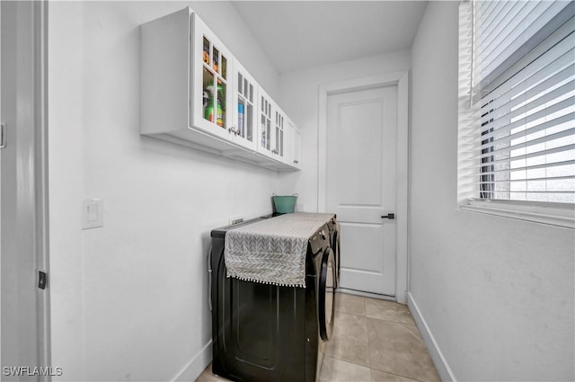 2607 4th St SW, Lehigh Acres, FL 33976 - laundry area featuring separate washer and dryer and light tile patterned floors