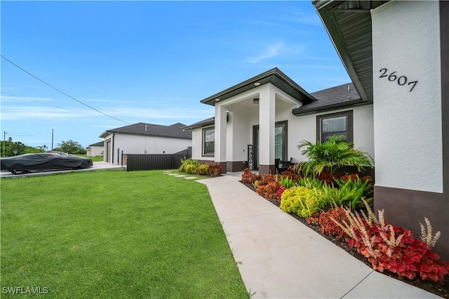 2607 4th St SW, Lehigh Acres, FL 33976 - view of front of house featuring stucco siding