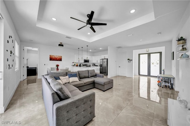 2607 4th St SW, Lehigh Acres, FL 33976 - living area featuring a tray ceiling, recessed lighting, ceiling fan, and light tile patterned floors