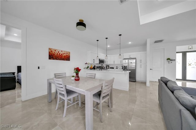 2607 4th St SW, Lehigh Acres, FL 33976 - dining space featuring light marble finish flooring and recessed lighting