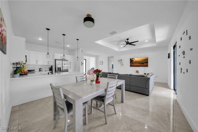 2607 4th St SW, Lehigh Acres, FL 33976 - dining room with a ceiling fan, recessed lighting, and a tray ceiling