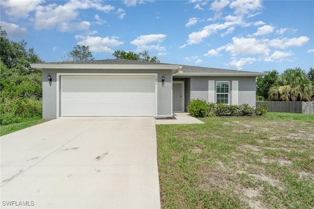 1492 Schenley St, Port Charlotte, FL 33952 - view of front of house with stucco siding, concrete driveway, and an attached garage