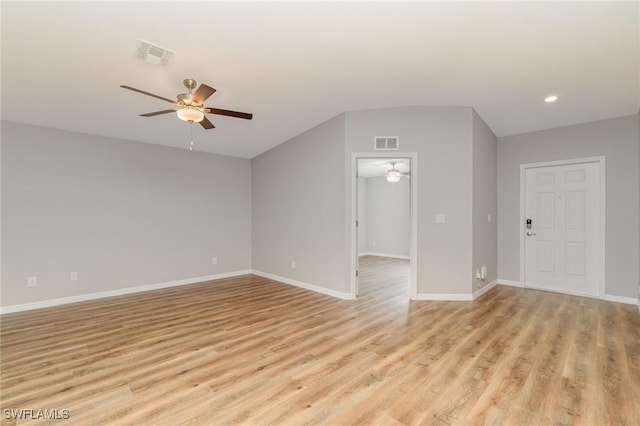 1492 Schenley St, Port Charlotte, FL 33952 - spare room with a ceiling fan, light wood-type flooring, vaulted ceiling, and recessed lighting