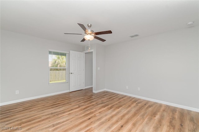 1492 Schenley St, Port Charlotte, FL 33952 - spare room with a ceiling fan, light wood finished floors, and a smoke detector