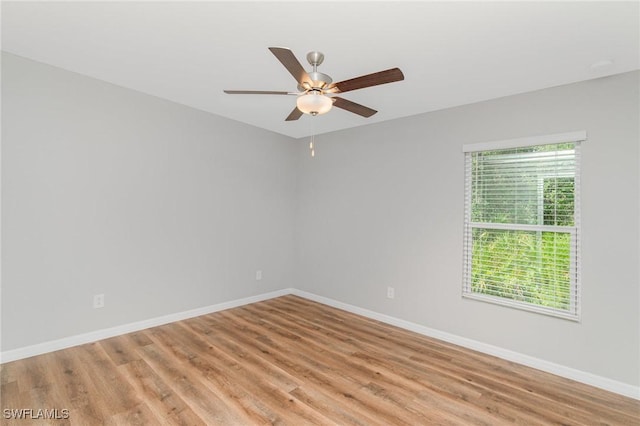 1492 Schenley St, Port Charlotte, FL 33952 - empty room with a ceiling fan and light wood-style flooring