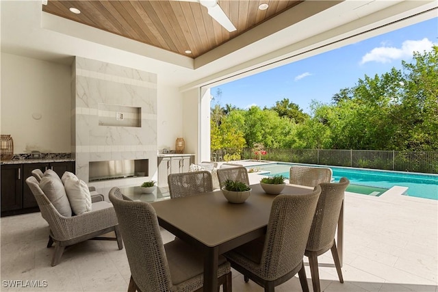 61 14th St S, Naples, FL 34102 - dining room featuring wooden ceiling, a tray ceiling, and recessed lighting