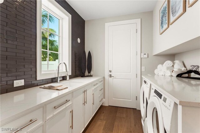 61 14th St S, Naples, FL 34102 - laundry room with dark wood-style flooring, independent washer and dryer, and cabinet space