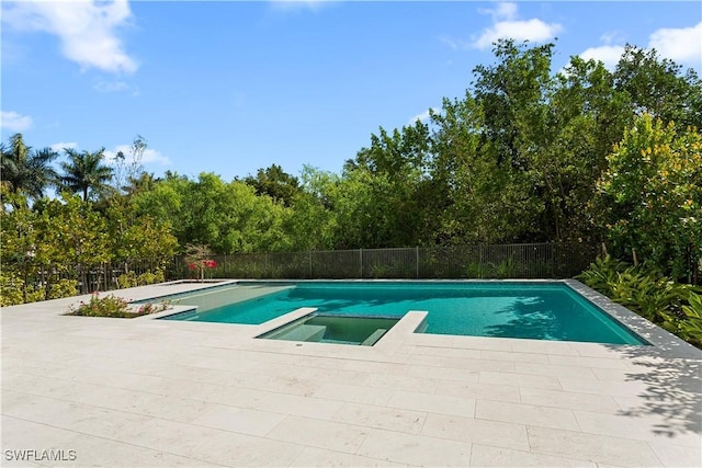 61 14th St S, Naples, FL 34102 - view of pool with a pool with connected hot tub and view of wooded area