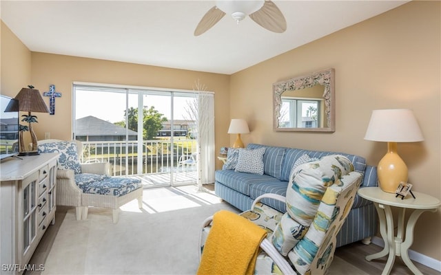 4549 SE 5th Pl Unit 211, Cape Coral, FL 33904 - living room featuring healthy amount of natural light, ceiling fan, and carpet flooring