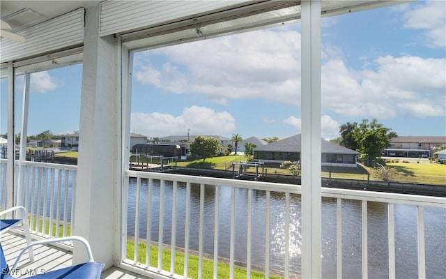 4549 SE 5th Pl Unit 211, Cape Coral, FL 33904 - sunroom / solarium featuring a water view and a residential view
