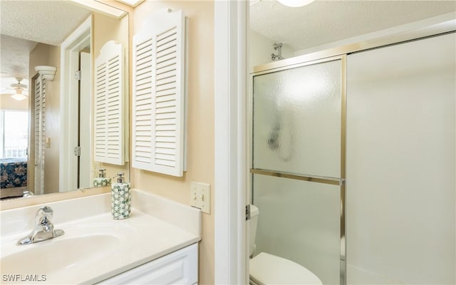 4549 SE 5th Pl Unit 211, Cape Coral, FL 33904 - full bath featuring a textured ceiling, vanity, a shower with shower door, and a ceiling fan