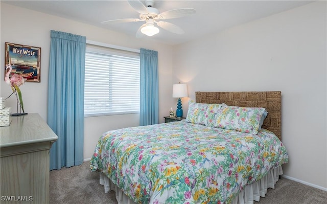 4549 SE 5th Pl Unit 211, Cape Coral, FL 33904 - carpeted bedroom featuring a ceiling fan and baseboards