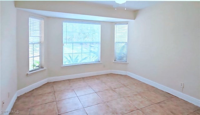 2640 4th Ave NE, Naples, FL 34120 - unfurnished room with plenty of natural light and light tile patterned floors
