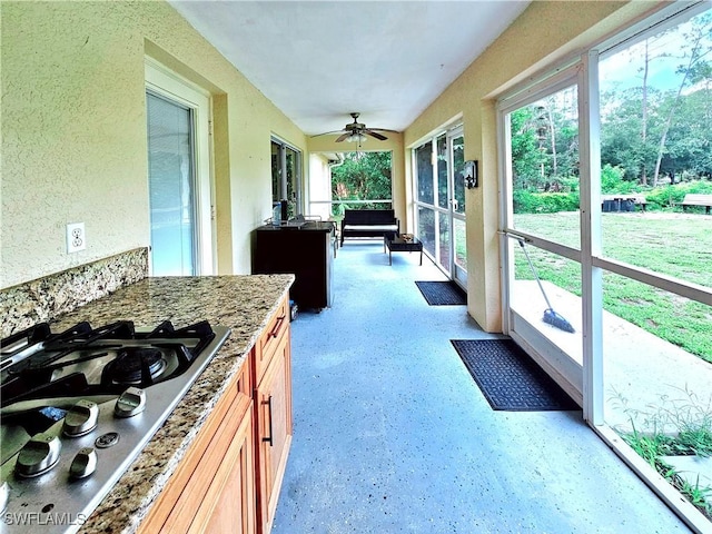 2640 4th Ave NE, Naples, FL 34120 - sunroom featuring a ceiling fan