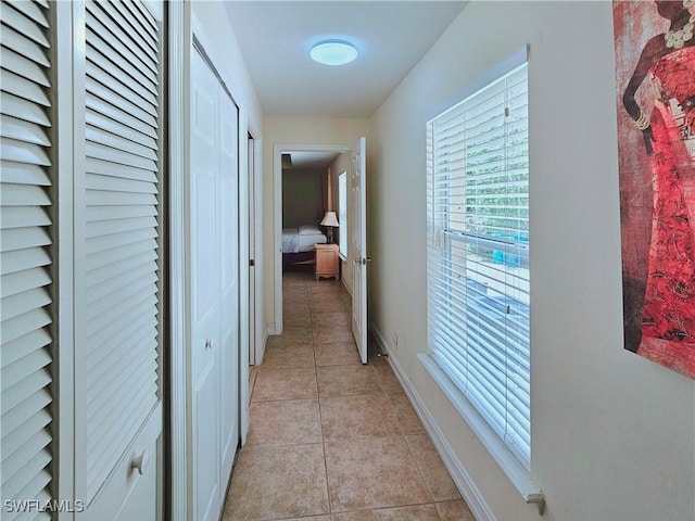 2640 4th Ave NE, Naples, FL 34120 - hall with light tile patterned floors and baseboards