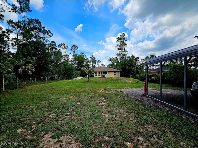 2640 4th Ave NE, Naples, FL 34120 - view of green lawn with driveway