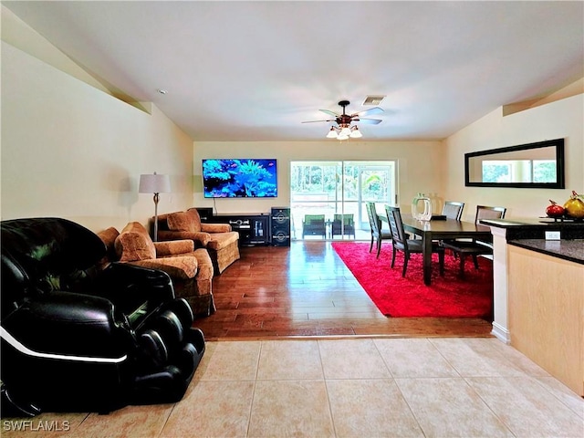2640 4th Ave NE, Naples, FL 34120 - tiled living room with a ceiling fan and lofted ceiling