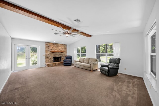 19350 Meredith Rd, North Fort Myers, FL 33917 - living area with healthy amount of natural light, a stone fireplace, carpet, and ceiling fan