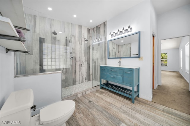 19350 Meredith Rd, North Fort Myers, FL 33917 - bathroom with a stall shower, vanity, recessed lighting, and wood finished floors
