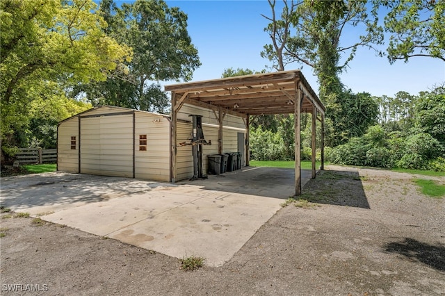19350 Meredith Rd, North Fort Myers, FL 33917 - view of parking featuring a detached carport and concrete driveway