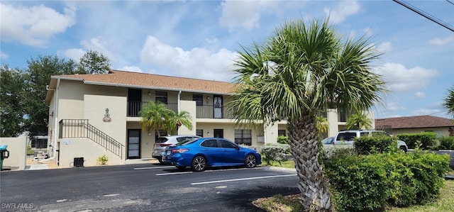 642 SE 13th Pl Unit 5, Cape Coral, FL 33990 - view of property featuring uncovered parking