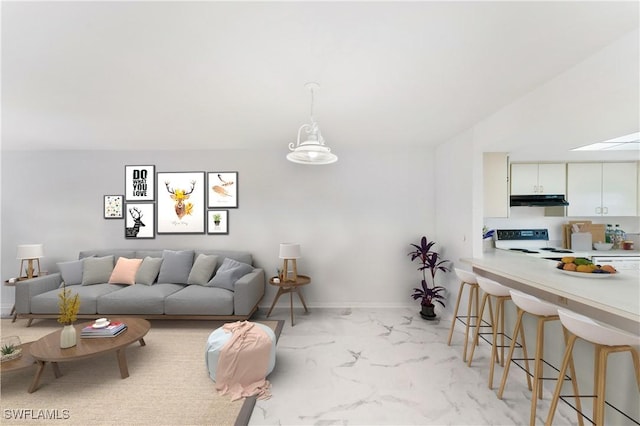 642 SE 13th Pl Unit 5, Cape Coral, FL 33990 - living area featuring light marble finish floors and baseboards