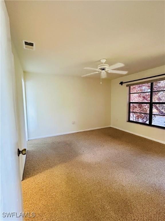 642 SE 13th Pl Unit 5, Cape Coral, FL 33990 - empty room with carpet floors and a ceiling fan