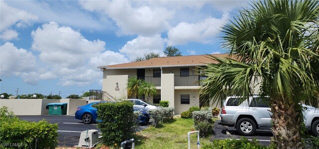 642 SE 13th Pl Unit 5, Cape Coral, FL 33990 - view of property with uncovered parking