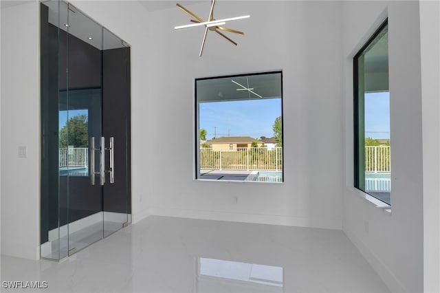 1040 NE 11th Ave, Cape Coral, FL 33909 - unfurnished room featuring plenty of natural light