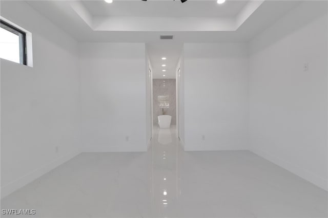 1040 NE 11th Ave, Cape Coral, FL 33909 - spare room with recessed lighting and a tray ceiling
