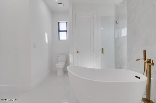 1040 NE 11th Ave, Cape Coral, FL 33909 - bathroom featuring a freestanding bath and marble finish floors